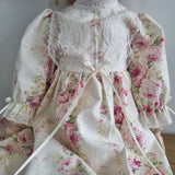 Floral fabric with lace details on a plain background
